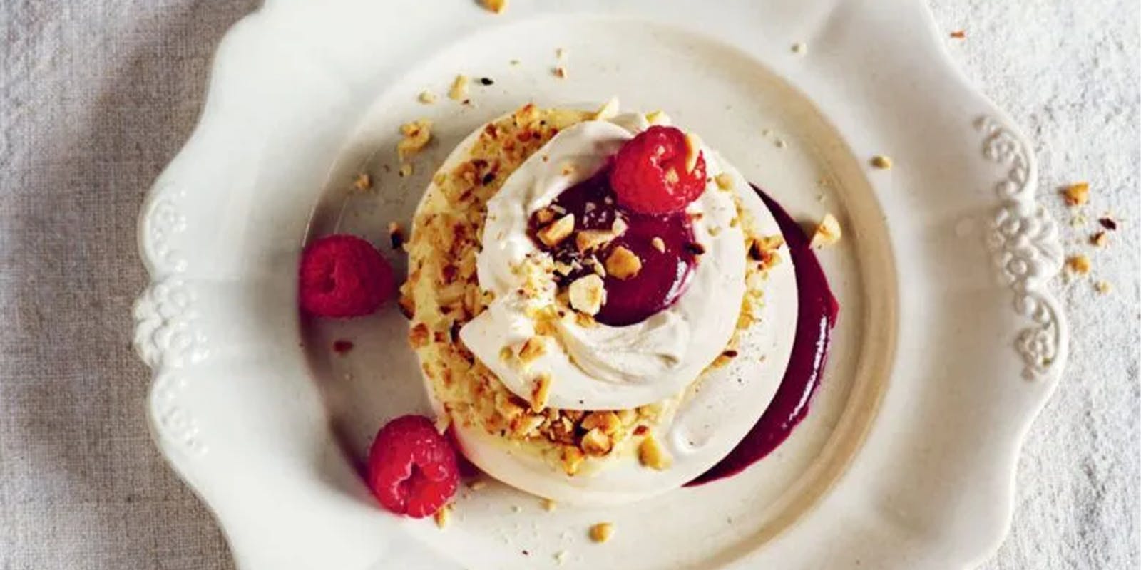 Rick Stein’s hazelnut pavlovas with white chocolate and dark berry sauce